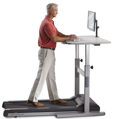 Man Walking on Lifespan Treadmill Desk to Avoid Sitting Too Much