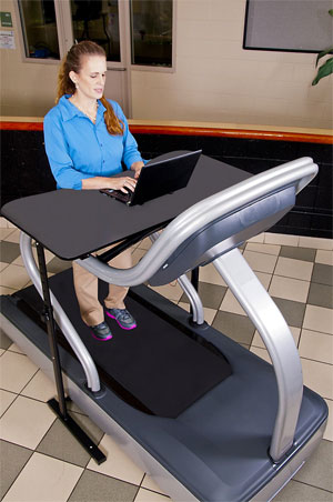 Woman Walking on Treadmill with Go Treadmill Desk